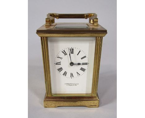 Garrard &amp; Co of London brass carriage clock, 12cm high, with a further deco glass clock and one other