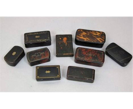 A collection of early 19th century snuff boxes in papier mache, the majority with inlaid brass string work and/or simulated t
