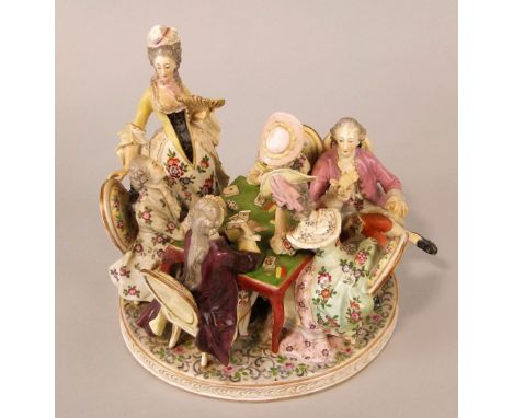 A continental figure group in the 18th century manner of ladies and gentlemen playing cards, with blue painted crown and inte