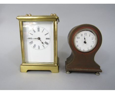 Brass cased carriage clock with simple windup movement, together with a further copper cased miniature mantel clock (2)