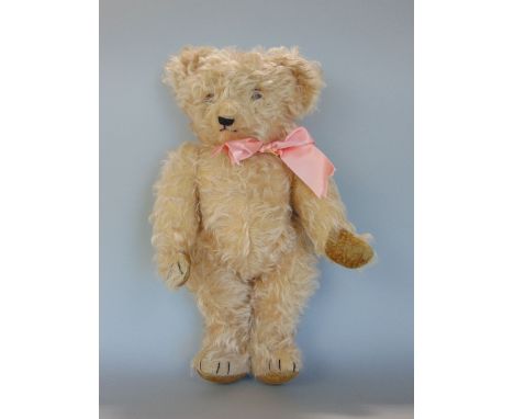 1940s teddy bear, possibly Chiltern, with jointed limbs, stitched mouth, nose and claws, 15" tall