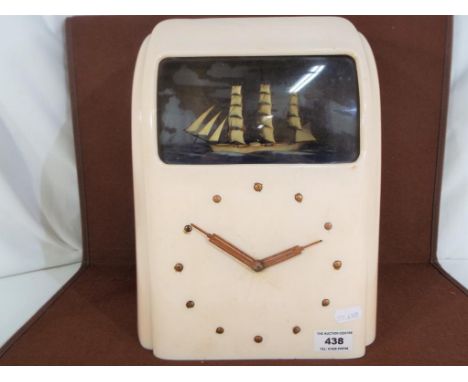 A Vitascope Industries Ltd bakelite cased electric ship automaton clock, cream case with curved front and seascape with three