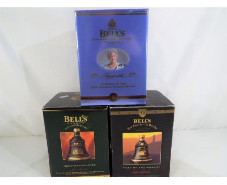 Bells Old Scotch Whisky - three commemorative decanters containing 8 and 12 year old extra special Old Scotch Whisky, all exc