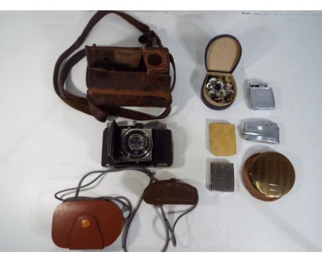 Lot to include a Kodak Retina folding camera in case, two Ronson cigarette lighters, a Stratton powder compact and a box of c