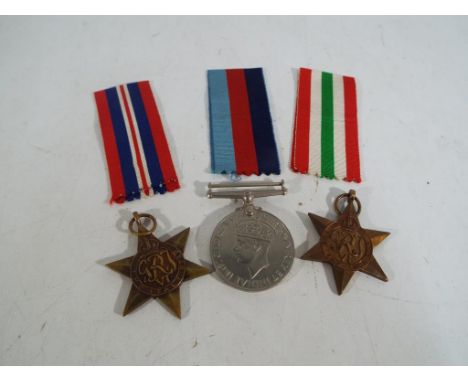Three World War II (WW2) medals with ribbons, boxed. Estimate £30 - £40