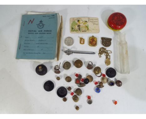 A mixed lot to include a Royal Air Force service and release book, a quantity of vintage buttons, glass jar,  white metal bro