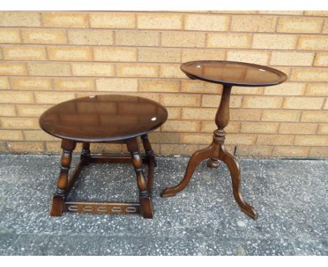 A mahogany tripod table and a dark oak round occasional table [2]