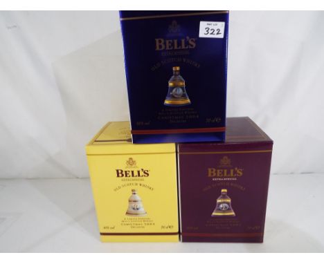 Bells Old Scotch Whisky - three Christmas decanters containing 8 year old extra special Old Scotch Whisky, 2002,2003 and 2004