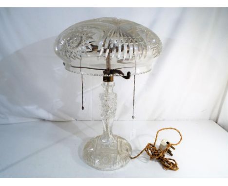 An antique cut glass mushroom lamp approximately 47 cm (h). Est £100 - £200