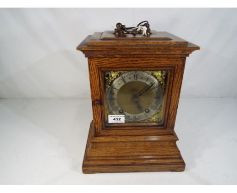 An good oak cased quarter striking ting-tang library mantel clock by the German factory of Winterhalder & Hofmeier (W&H), gla