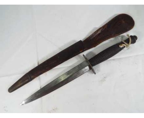 A WW2 (World War Two) sterile 3rd Pattern Army Commando Fairbairn Sykes FS Fighting Knife original leather sheath.  Est £60 -