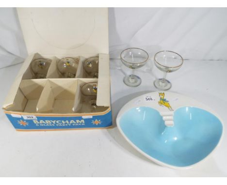 Six vintage Babycham glasses in original box and a ceramic Babycham ashtray by Beswick (2) Estimate £20 - £40