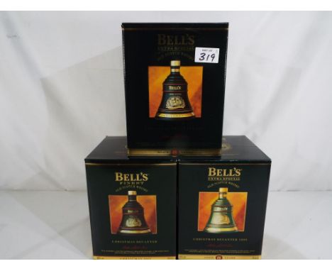 Bells Old Scotch Whisky - three Christmas decanters containing 8 year old extra special Old Scotch Whisky, 1993, 1994 and 199