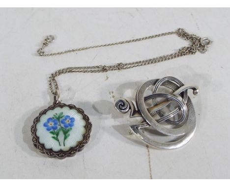 A silver guillache enamelled floral locket set with marcasite and chain and a vintage Ola Gorie sterling silver Kells brooch 