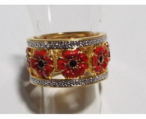 A Bradford Exchange gilded ring decorated with poppies. Estimate £20 - £30