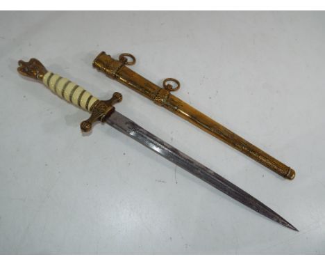 A World War II (WW2)  German KriegsmarineNaval Officer's Dagger with a brass scabbard with lightning flashes decoration, cros