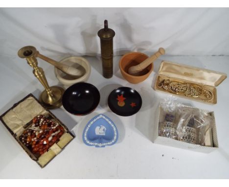 A good mixed lot to include two mortar and pestles, two brass and silver plated coffee glasses, a Wedgwood Jasperware pin dis