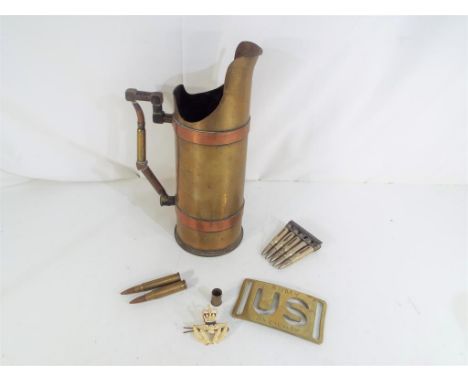 A trench art shell case, a brass belt buckle inscribed US Army 7th Cavalry, verso inscribed Price & Co, deactivated rifle car