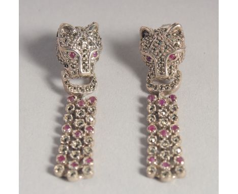 A PAIR OF SILVER RUBY SET PANTHER DROP EARRINGS.