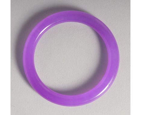 A GOOD LAVENDER JADE BANGLE. 3ins diameter.