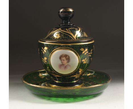 A GOOD BOHEMIAN BOWL, COVER AND STAND with enamel portrait of child and flowers. 5.75ins diameter.