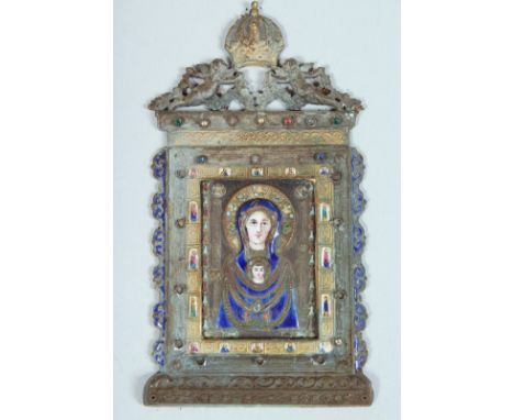 A SUPERB QUALITY GILT AND ENAMEL ICON, the metal frame with cupids and crown. 4ins x 2ins overall in a folding leather case.