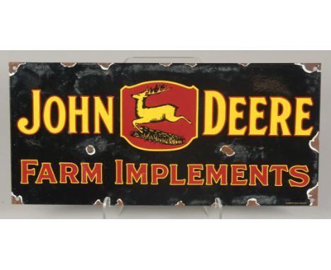 AN ENAMEL `JOHN DEER' SIGN. 8ins x 17ins.