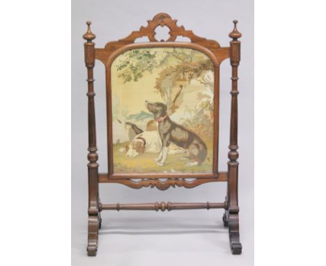 A GOOD VICTORIAN MAHOGANY FIRE SCREEN with a Brussels needlework panel of two dogs, with glazed front. Needlework: 36ins x 18