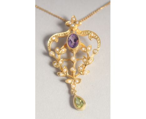 A SILVER GOLD PLATED SUFFRAGETTE AMETHYST, PERIDOT AND RUBY PENDANT AND CHAIN.