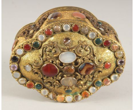 A GOOD CONTINENTAL GILT METAL, OVAL SHAPED JEWELL CASKET set with numerous agate and jade stones. 6ins long x 4.5ins wide x 3