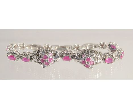 A SILVER RUBY SET MARCASITE PANTHER BRACELET.