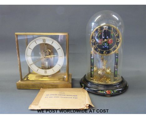 A Jungans retro electric mantel clock together with an anniversary clock
