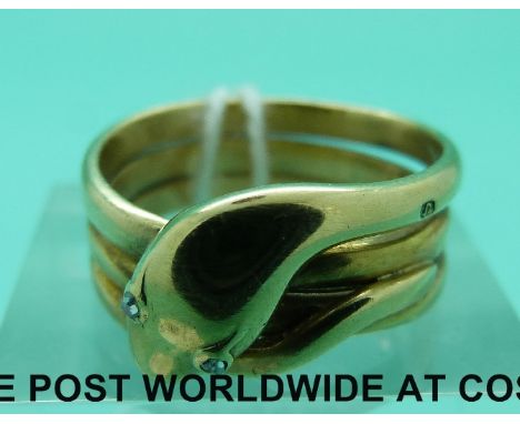 An 18ct gold ring in the form of a snake set with rose cut diamond eyes, London 1893 (8.4g, size M)