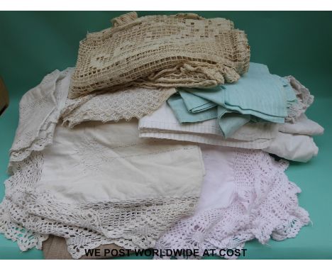 A box of various textiles, lace curtains and bed throws including an embroidered example with floral decoration, crochet, Lau