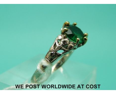 A white metal ring marked 18ct set with a soude doublet and diamonds to the shoulders (size M)