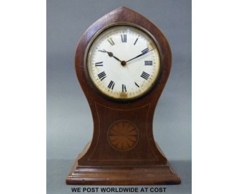A c1900 balloon style cased mantel timepiece with shell inlay decoration to case, enamelled dial, Roman numerals and black st