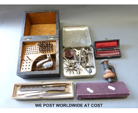 A quantity of specialist clock/watch maker's tools to include gauges, posi-set, drills, press clamp etc