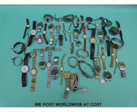 Over 50 various ladies and gentleman's wristwatches including Sekonda, vintage Timex, Swatch etc. 