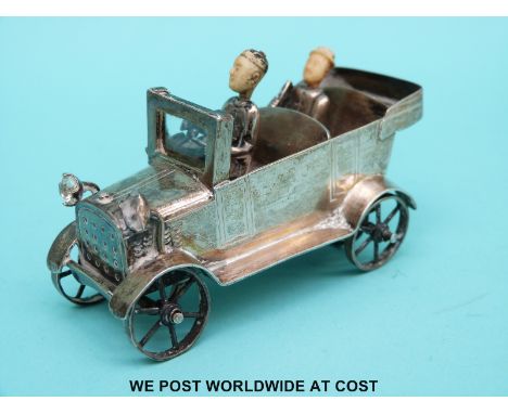 Chinese white metal model of a car with ivory headed driver and passenger and glass light, length 8.5cm