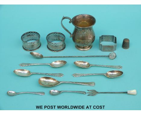 A quantity of hallmarked silver items to include tankard, height 8cm, three various napkin rings, spoons and a thimble (185g)