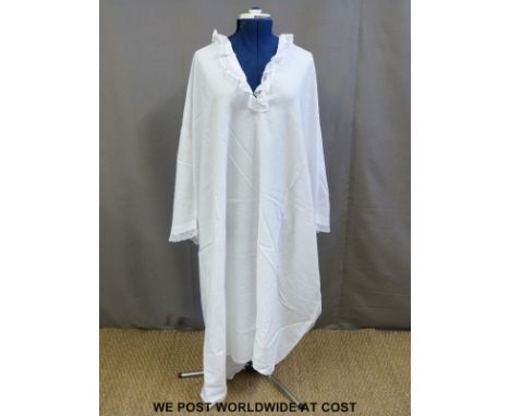 A nightdress once owned by Queen Victoria with her Royal emblem embroidered to the front of the garment together with a photo