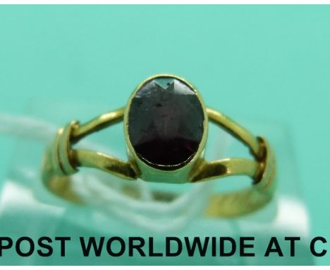 A late Georgian ring set with an oval garnet (size M)