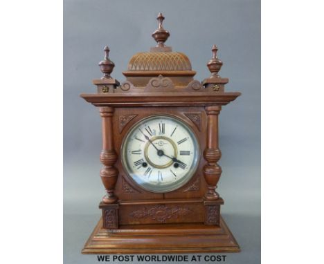 A carved early 20th century mantel clock by Tokyo Co. Japan "S" trade mark to painted dial, approximately 52cm tall