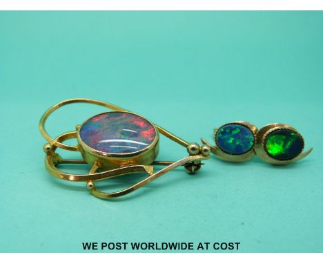 A yellow metal brooch set with an opal doublet and a pair of 9ct gold earrings set with synthetic opals