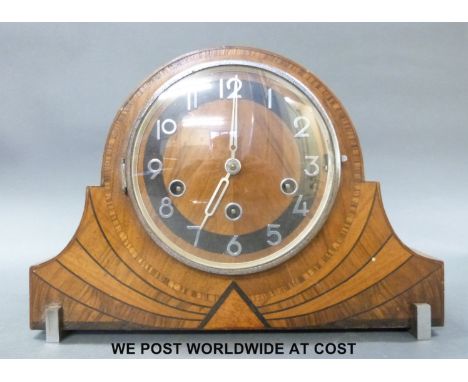 An Art Deco three train mantel clock with decorative inlay and chrome fittings and German Haller movement