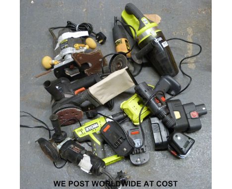 A quantity of tools to include JCB angle grinder, McKeller MCKMOS router, Ryobi drill and vacuum, Black & Decker sander etc.