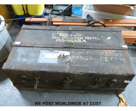 An ash and metal bound trunk with Union Castle stickers, stencilled 'G.Bee (pianist) New Carlton Hotel, Mombasa' (W87 x H32 x
