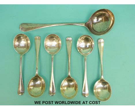 A set of six Walker and Hall George V hallmarked silver rat tail soup spoons, length 18cm, together with a matching ladle, le