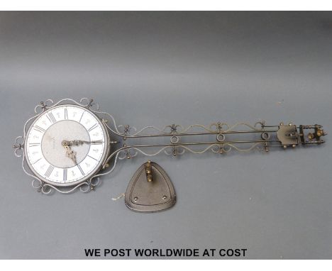 Schatz Elexacta swinging clock with bracket plus another similar example