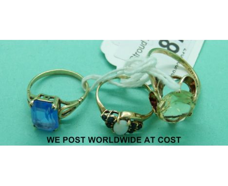 Three various 9ct gold rings, two set with paste and one set with an opal and sapphires (6.8g)